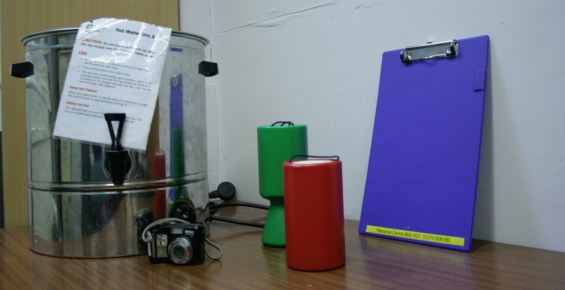 Water boiler, collecting tins, digital camera, clipboard